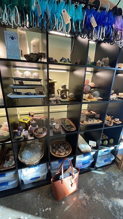 Selection of healing crystals, tumbled stones, and decorative mineral pieces