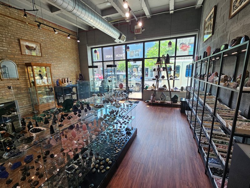 Collection of tumbled stones, raw minerals, and crystal clusters