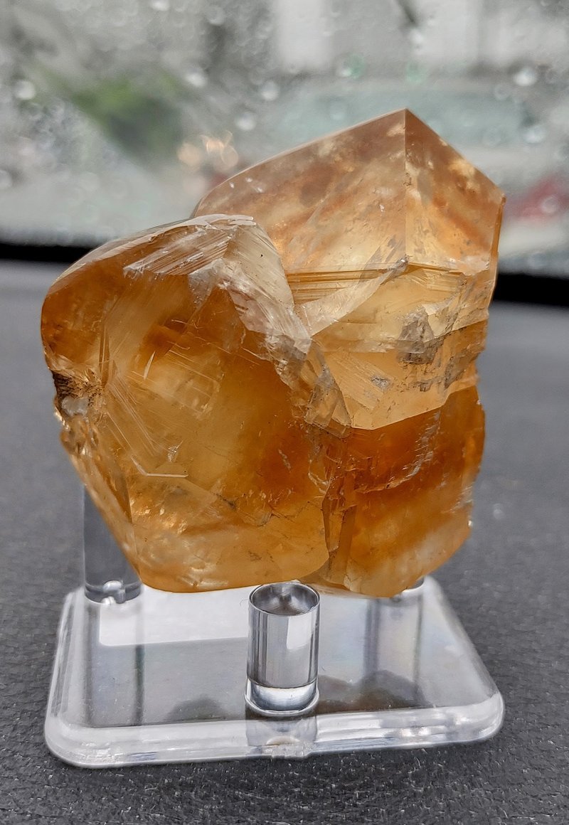 Variety of gemstones, crystal carvings, and polished mineral specimens