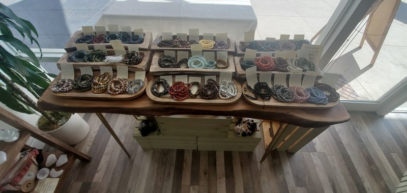 Shop interior featuring gemstones, healing crystals, and spiritual products