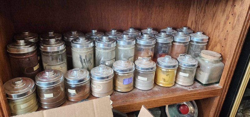 Display featuring crystal points, polished stones, and raw mineral specimens