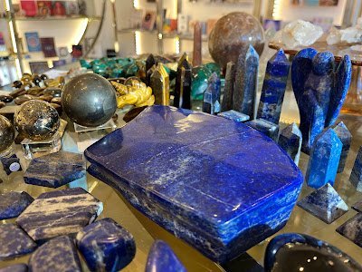 Organized crystal display with labeled stones and healing minerals