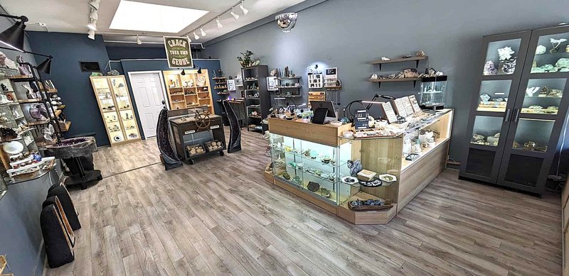 Shop interior featuring gemstones, healing crystals, and spiritual products