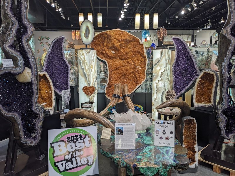 Selection of healing crystals, tumbled stones, and decorative mineral pieces