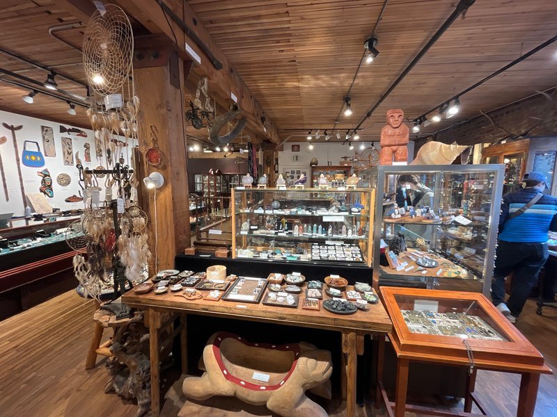 Display of polished crystal specimens, geodes, and mineral towers