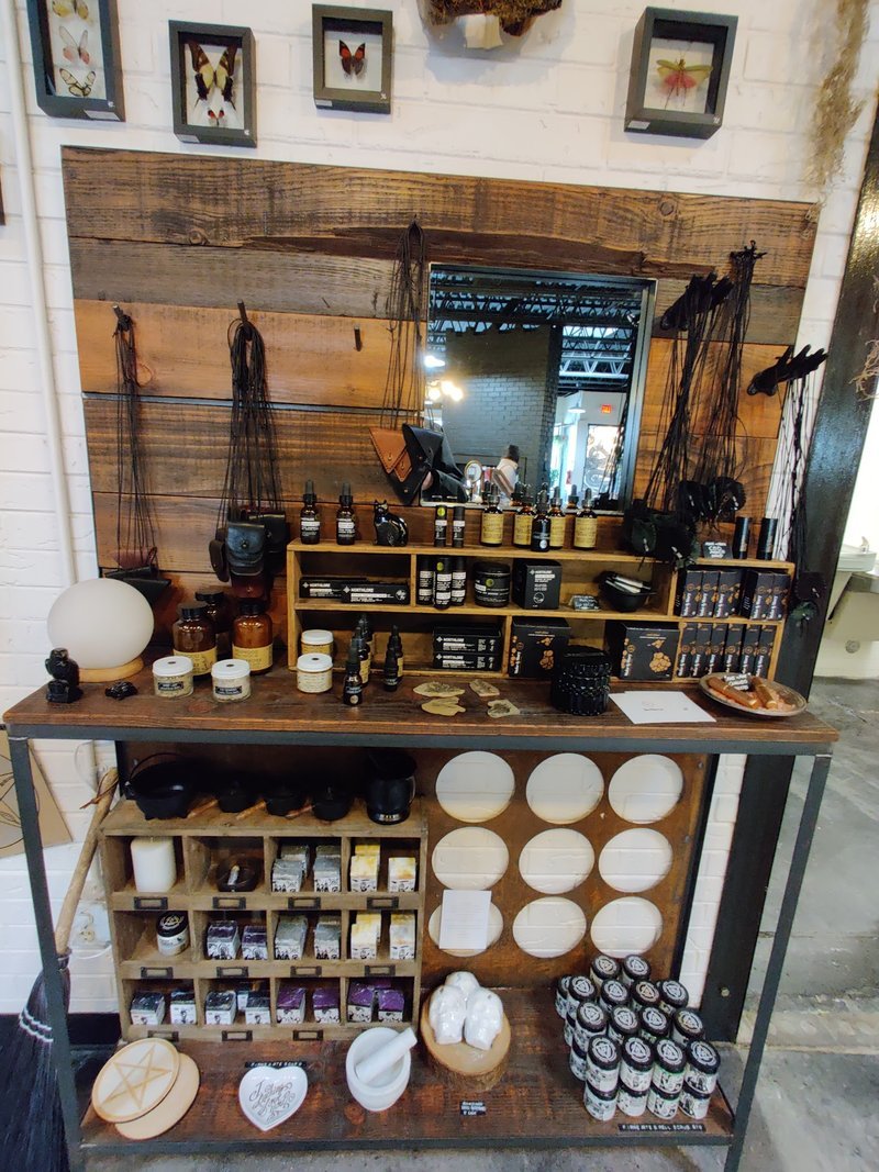 Display featuring crystal points, polished stones, and raw mineral specimens