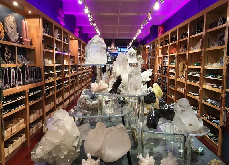Retail display with tumbled stones, raw crystals, and polished specimens