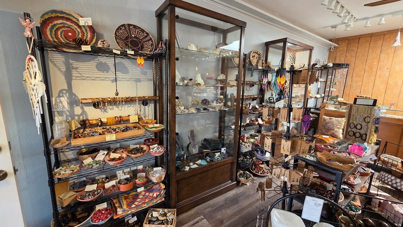 Display of polished crystal specimens, geodes, and mineral towers