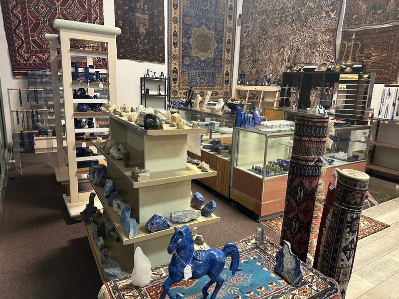 Retail display with tumbled stones, raw crystals, and polished specimens