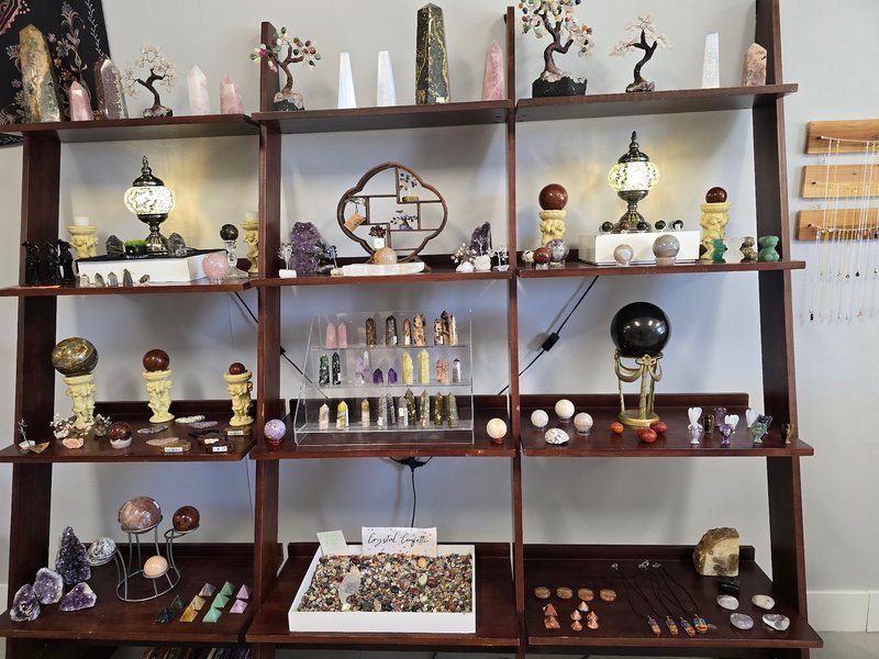 Organized crystal display with labeled stones and healing minerals