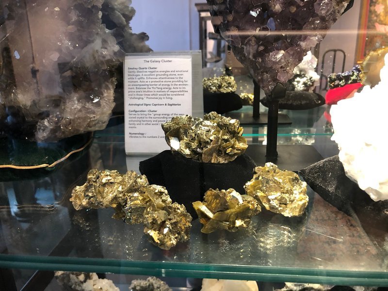 Selection of healing crystals, tumbled stones, and decorative mineral pieces