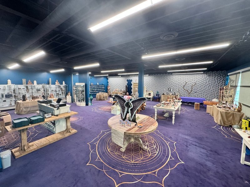 Display of polished crystal specimens, geodes, and mineral towers