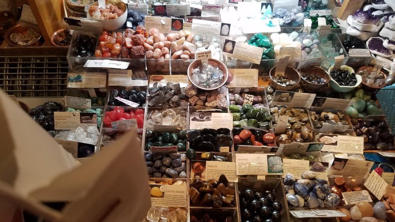 Display of polished crystal specimens, geodes, and mineral towers
