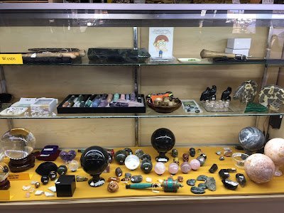 Display of polished crystal specimens, geodes, and mineral towers