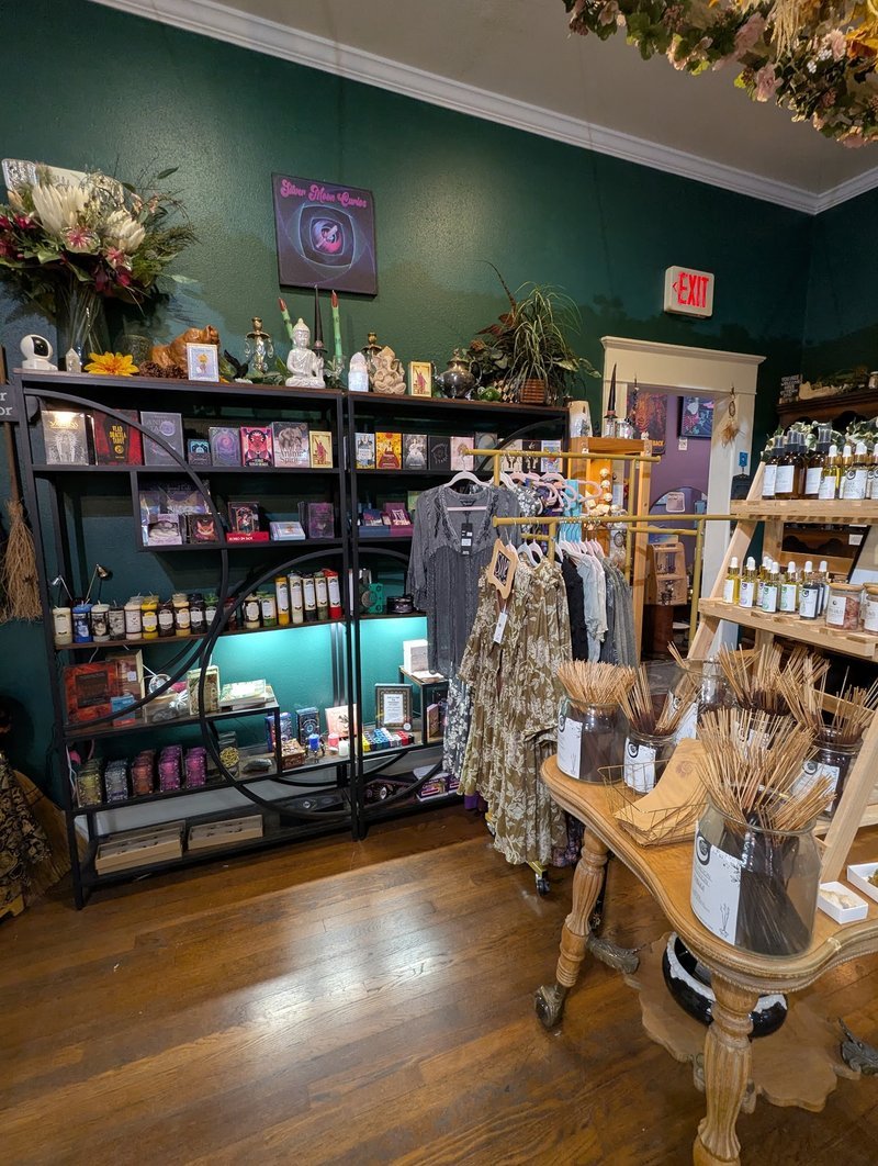 Shelving display featuring amethyst, quartz, and various crystal specimens