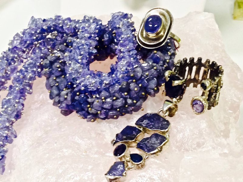 Retail shelving with organized crystals, stones, and spiritual products