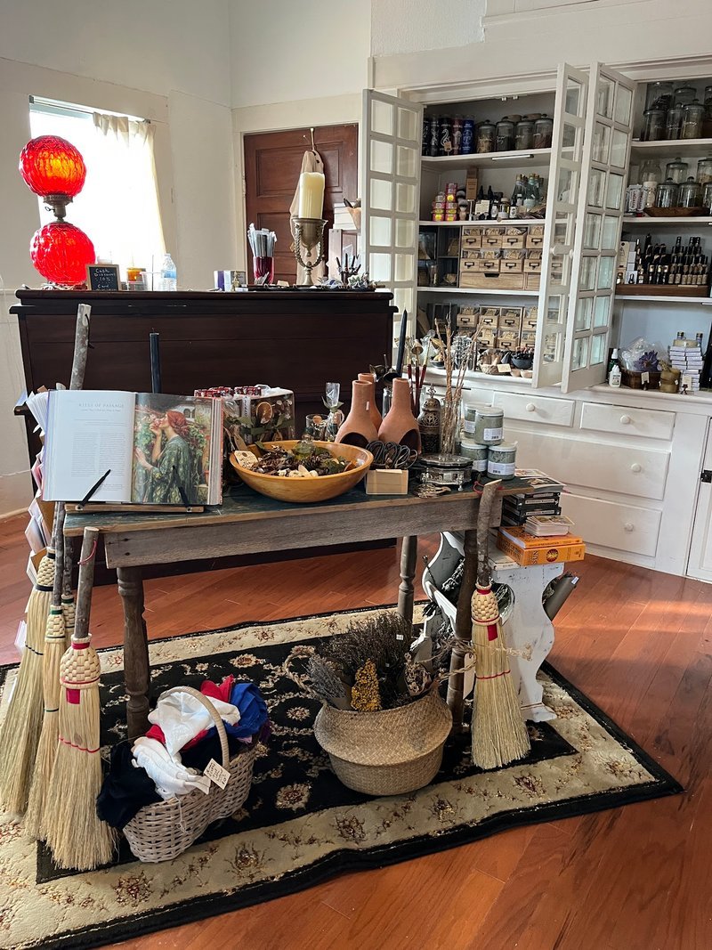 Shelving display featuring amethyst, quartz, and various crystal specimens