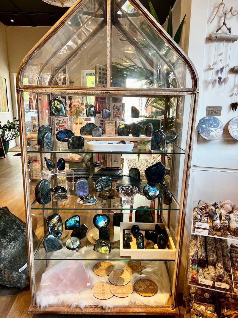 Display of polished crystal specimens, geodes, and mineral towers