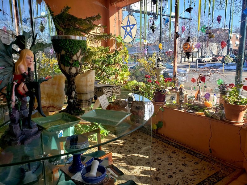 Shop interior featuring gemstones, healing crystals, and spiritual products