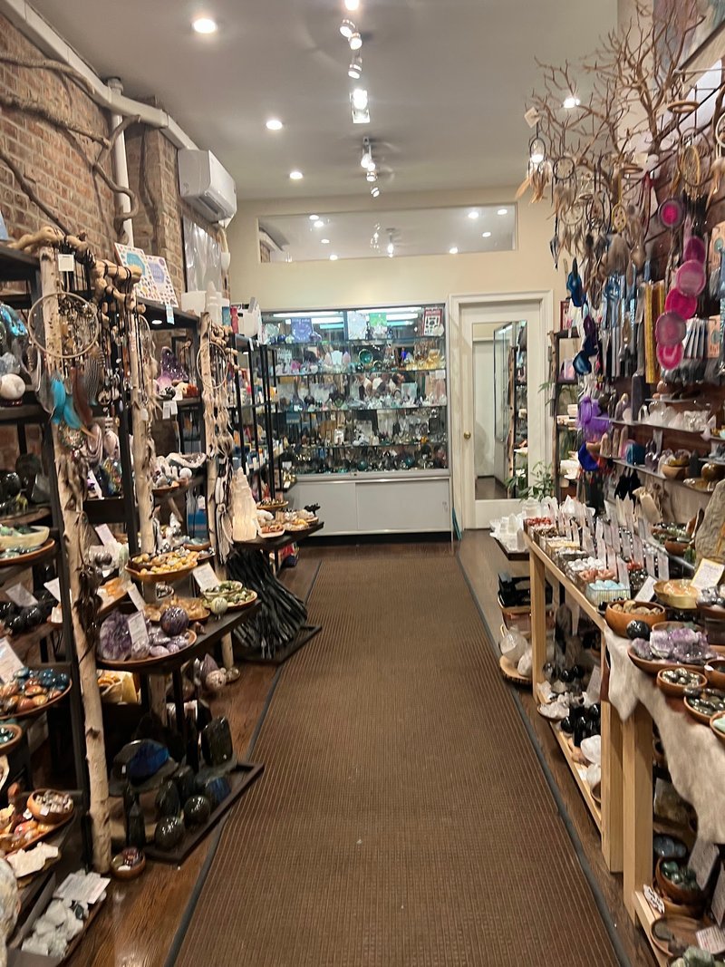 Display of polished crystal specimens, geodes, and mineral towers