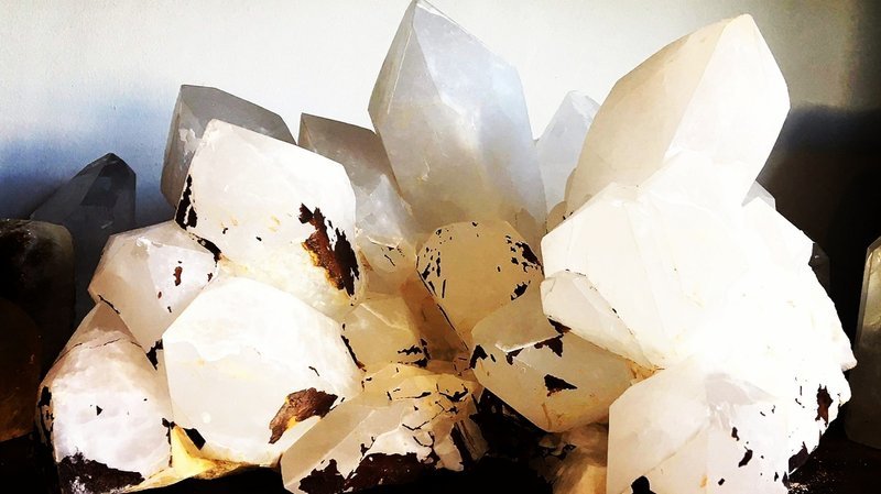 Interior view showcasing crystal towers, spheres, and carved stone pieces