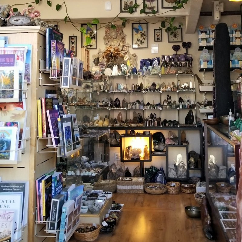 Organized crystal display with labeled stones and healing minerals