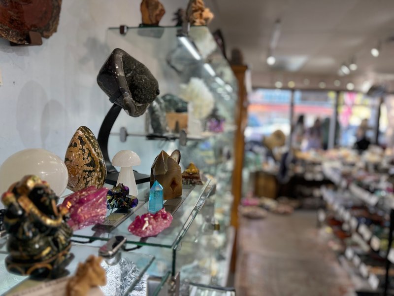 Organized crystal display with labeled stones and healing minerals