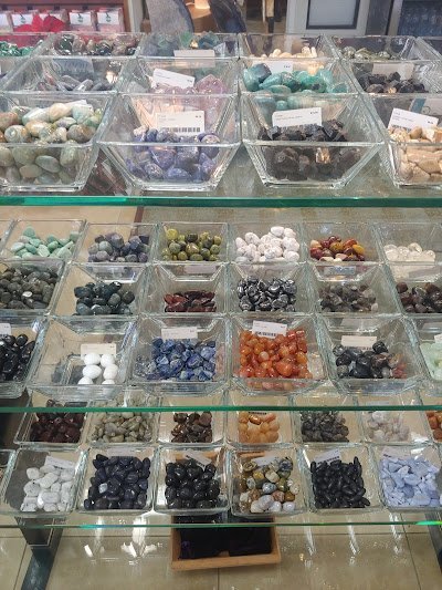 Shop interior featuring gemstones, healing crystals, and spiritual products