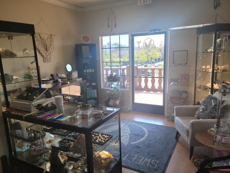 Selection of healing crystals, tumbled stones, and decorative mineral pieces