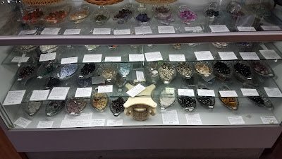 Crystal and mineral specimens including quartz, amethyst, and calcite varieties