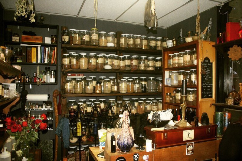 Retail shelving with organized crystals, stones, and spiritual products