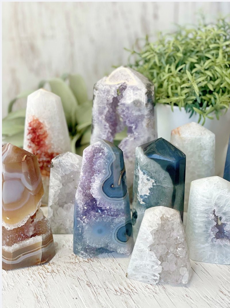 Selection of healing crystals, tumbled stones, and decorative mineral pieces