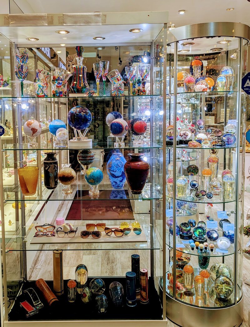 Crystal and mineral specimens including quartz, amethyst, and calcite varieties