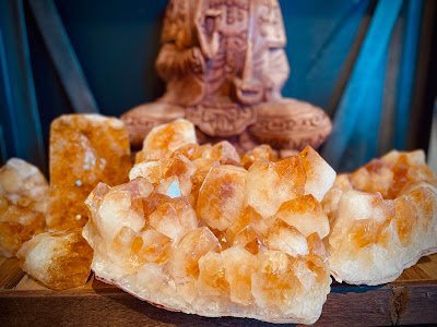 Store interior displaying crystals, minerals, and metaphysical supplies