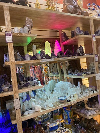 Retail shelving with organized crystals, stones, and spiritual products