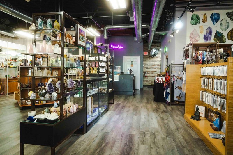 Shop interior featuring gemstones, healing crystals, and spiritual products