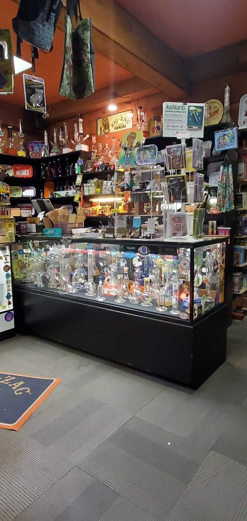 Variety of gemstones, crystal carvings, and polished mineral specimens