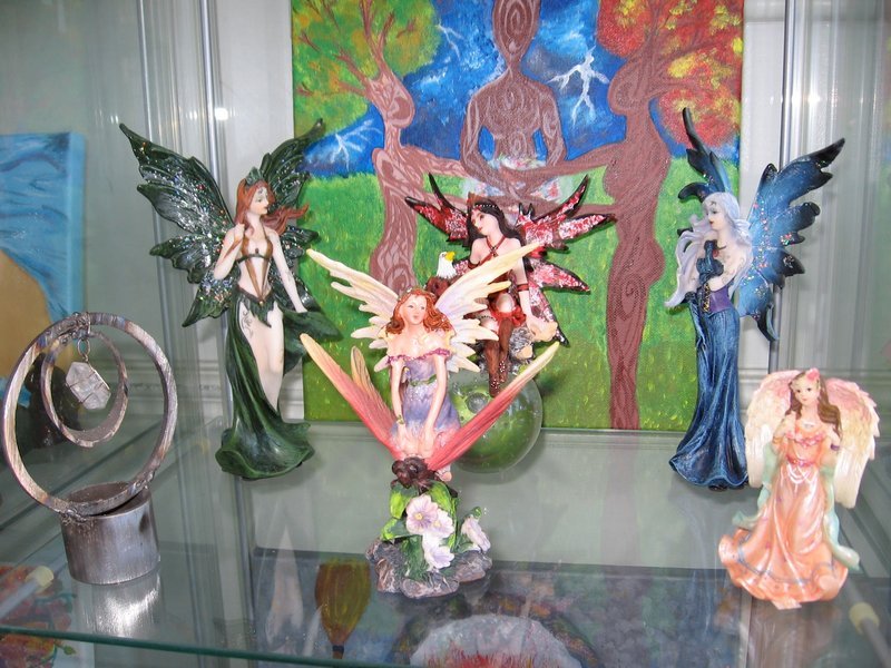 Retail shelving with organized crystals, stones, and spiritual products