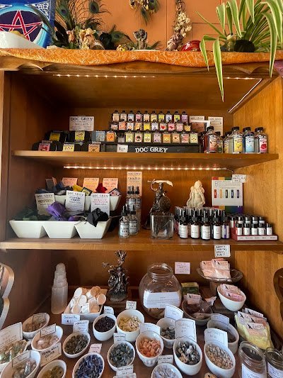 Retail shelving with organized crystals, stones, and spiritual products