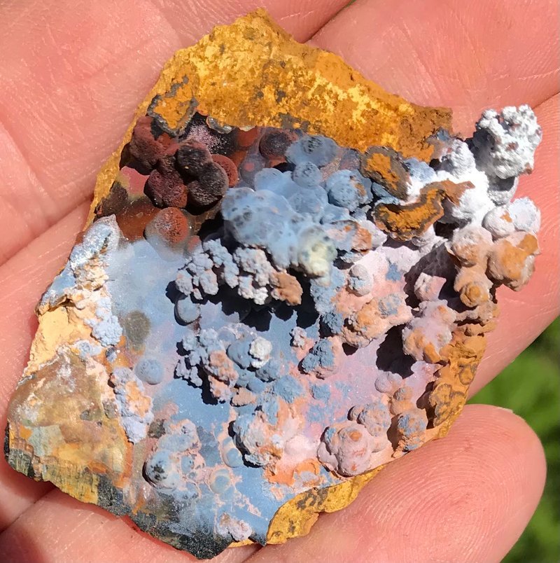 Retail shelving with organized crystals, stones, and spiritual products