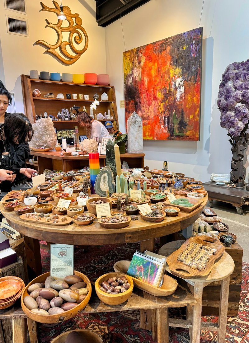 Display featuring crystal points, polished stones, and raw mineral specimens