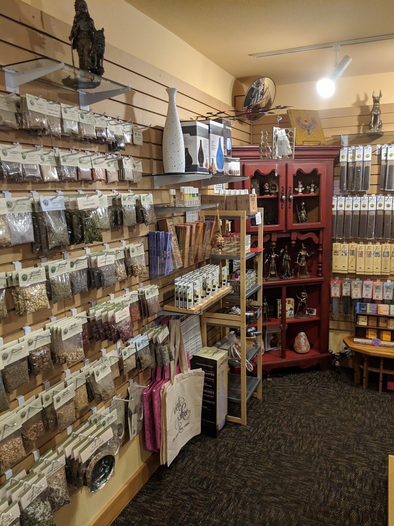 Shop interior featuring gemstones, healing crystals, and spiritual products