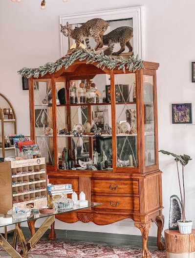 Selection of healing crystals, tumbled stones, and decorative mineral pieces