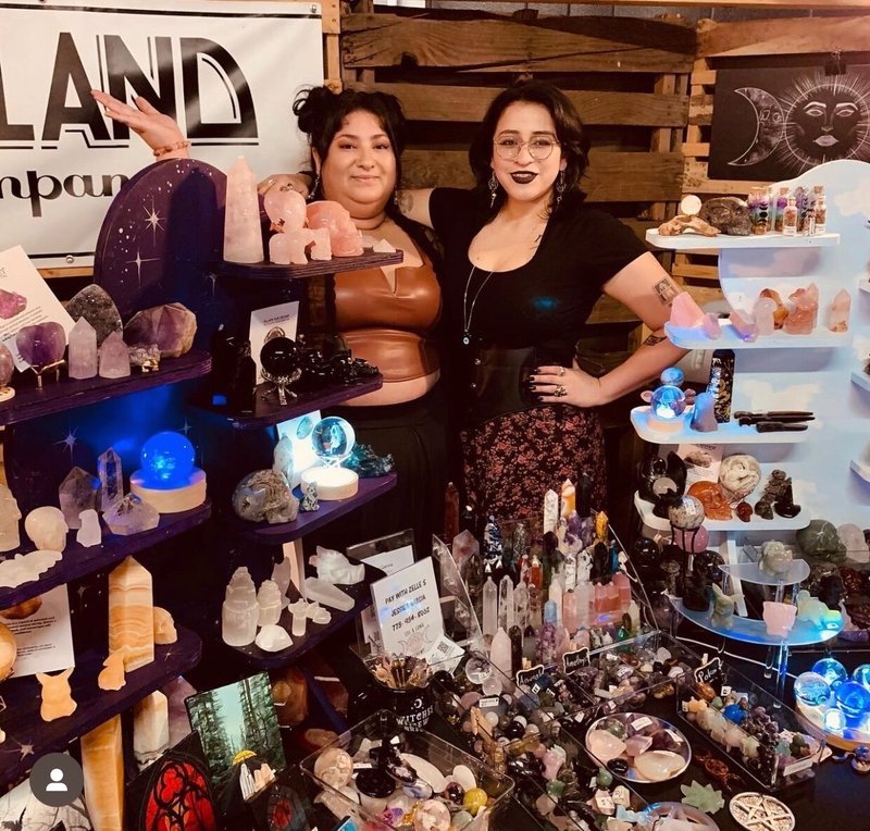 Display featuring crystal points, polished stones, and raw mineral specimens