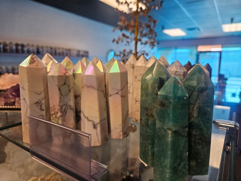 Organized crystal display with labeled stones and healing minerals