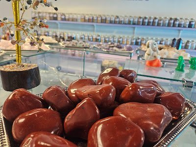 Selection of healing crystals, tumbled stones, and decorative mineral pieces