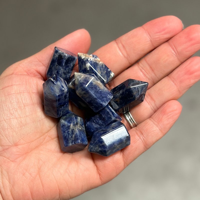Shelving display featuring amethyst, quartz, and various crystal specimens