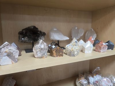 Collection of tumbled stones, raw minerals, and crystal clusters